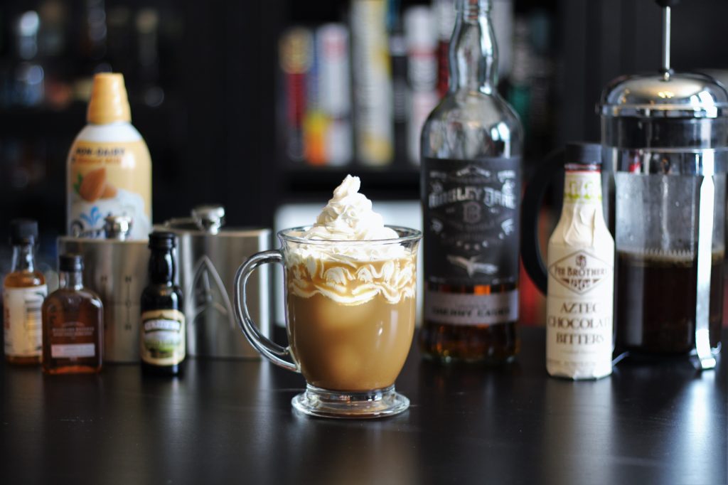 Corellian Coffee in a clear mug, with ingredients in the background