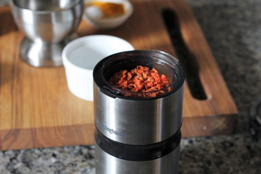 dehydrated carrots in a spice grinder