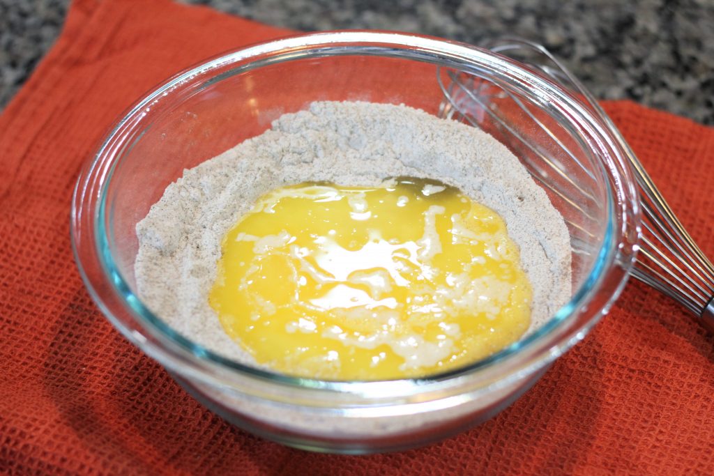 Melted butter and eggs added to the dry ingredients. 