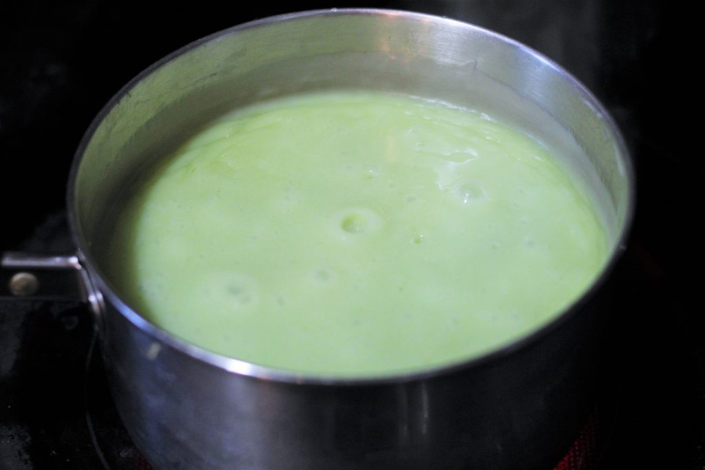 Ice cream base boiling in a saucepan. 